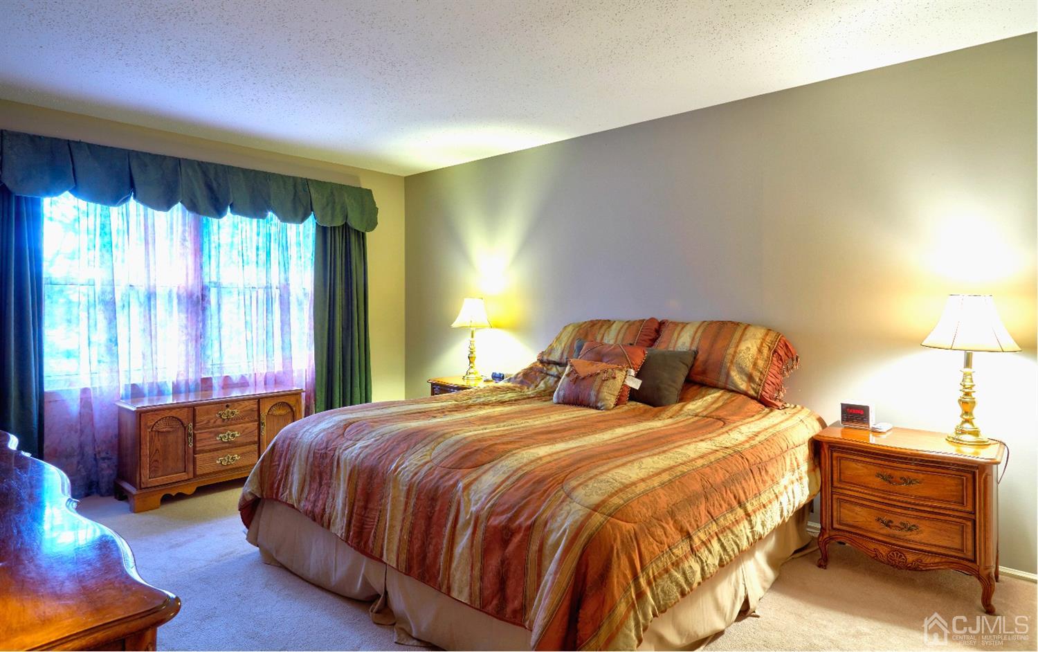 21 Aqueduct Place Howell, NJ 07731 - Photo 21 of 44 a bedroom with a bed and a night stand