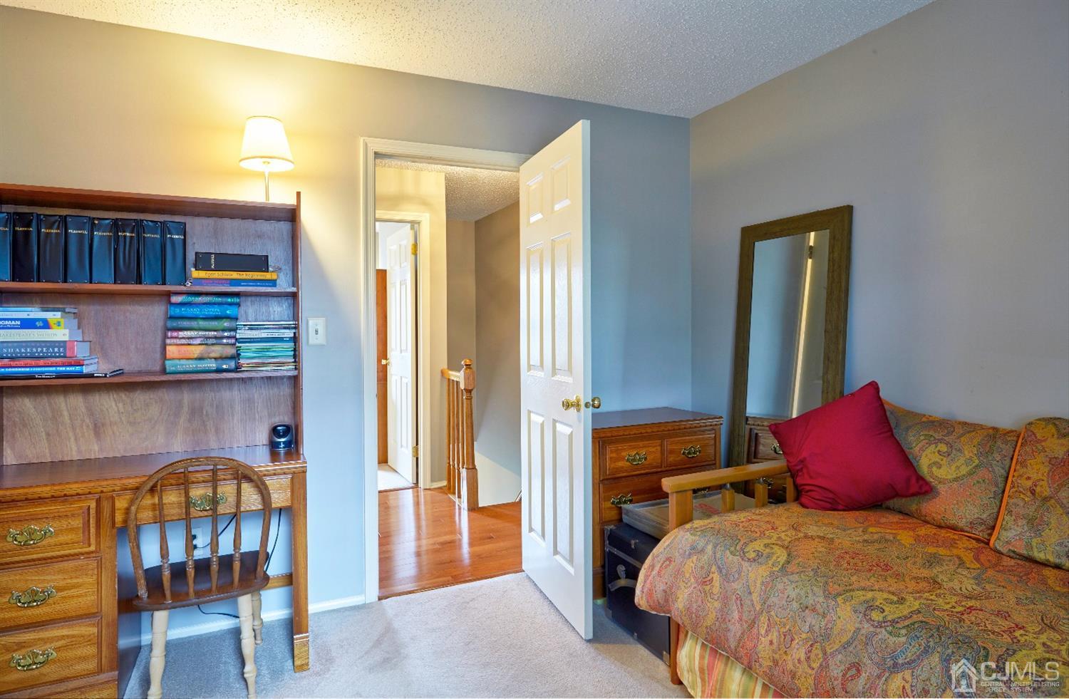 21 Aqueduct Place Howell, NJ 07731 - Photo 22 of 44 a bedroom with a bed and a bookshelf