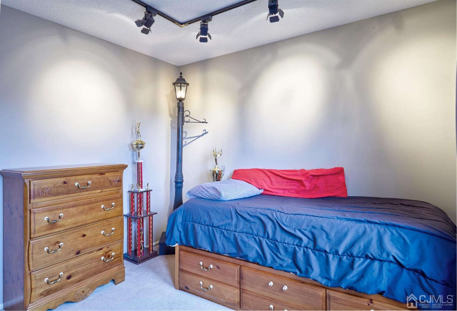 21 Aqueduct Place Howell, NJ 07731 - Photo 30 of 44 a bedroom with a bed and a dresser