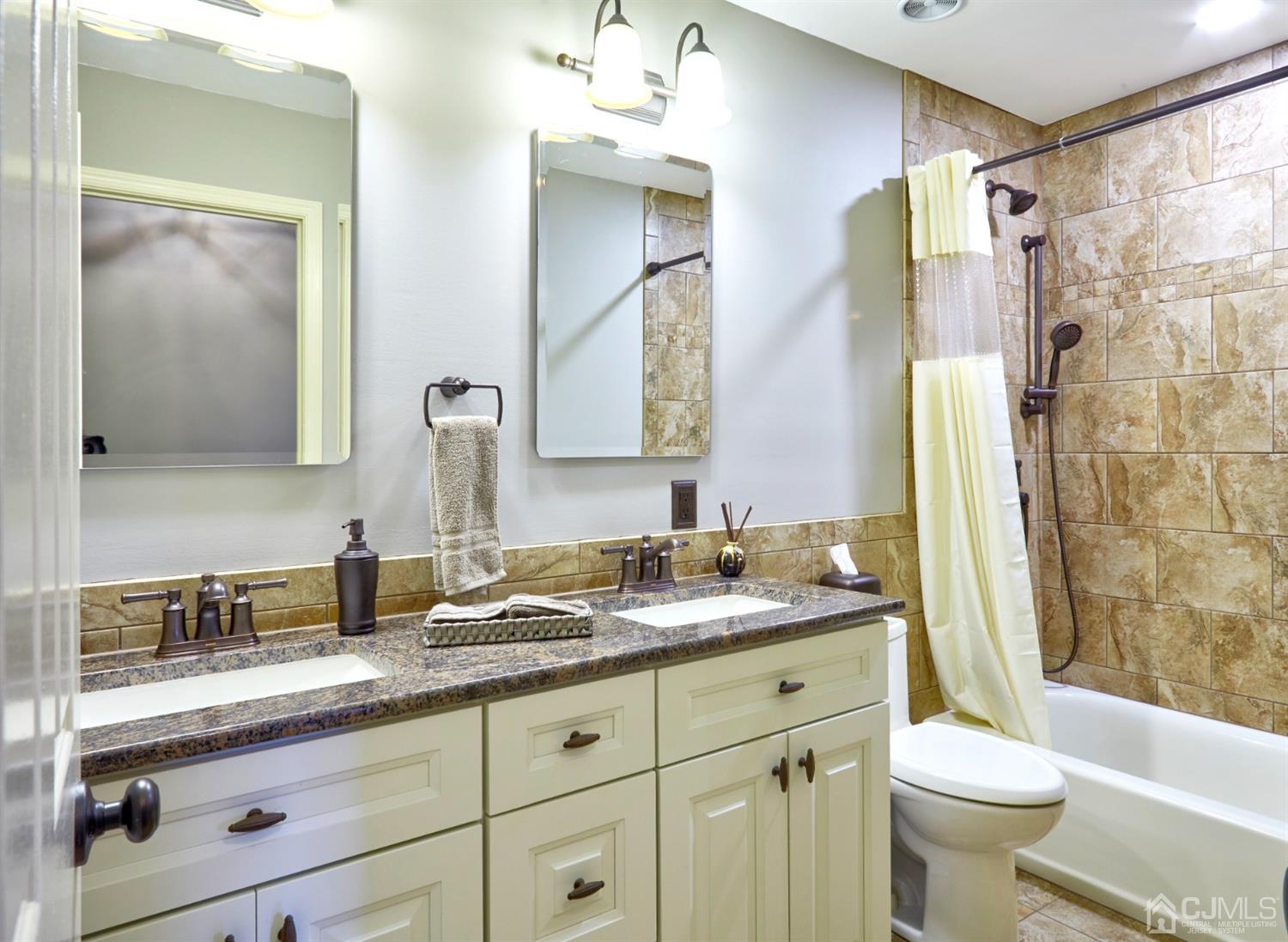 21 Aqueduct Place Howell, NJ 07731 - Photo 31 of 44 a bathroom with a granite countertop sink toilet and shower