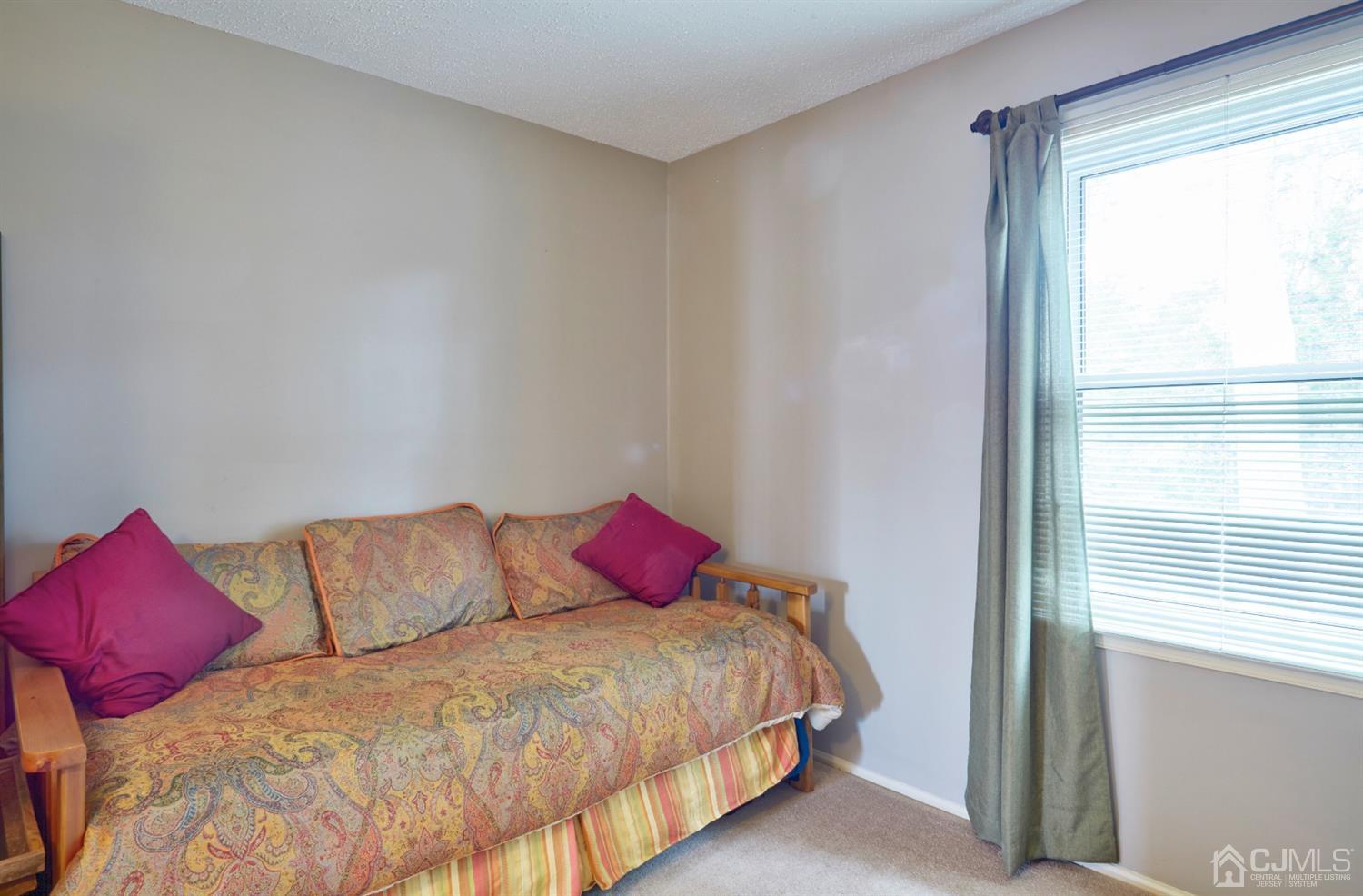 21 Aqueduct Place Howell, NJ 07731 - Photo 35 of 44 a bedroom with a bed and a window