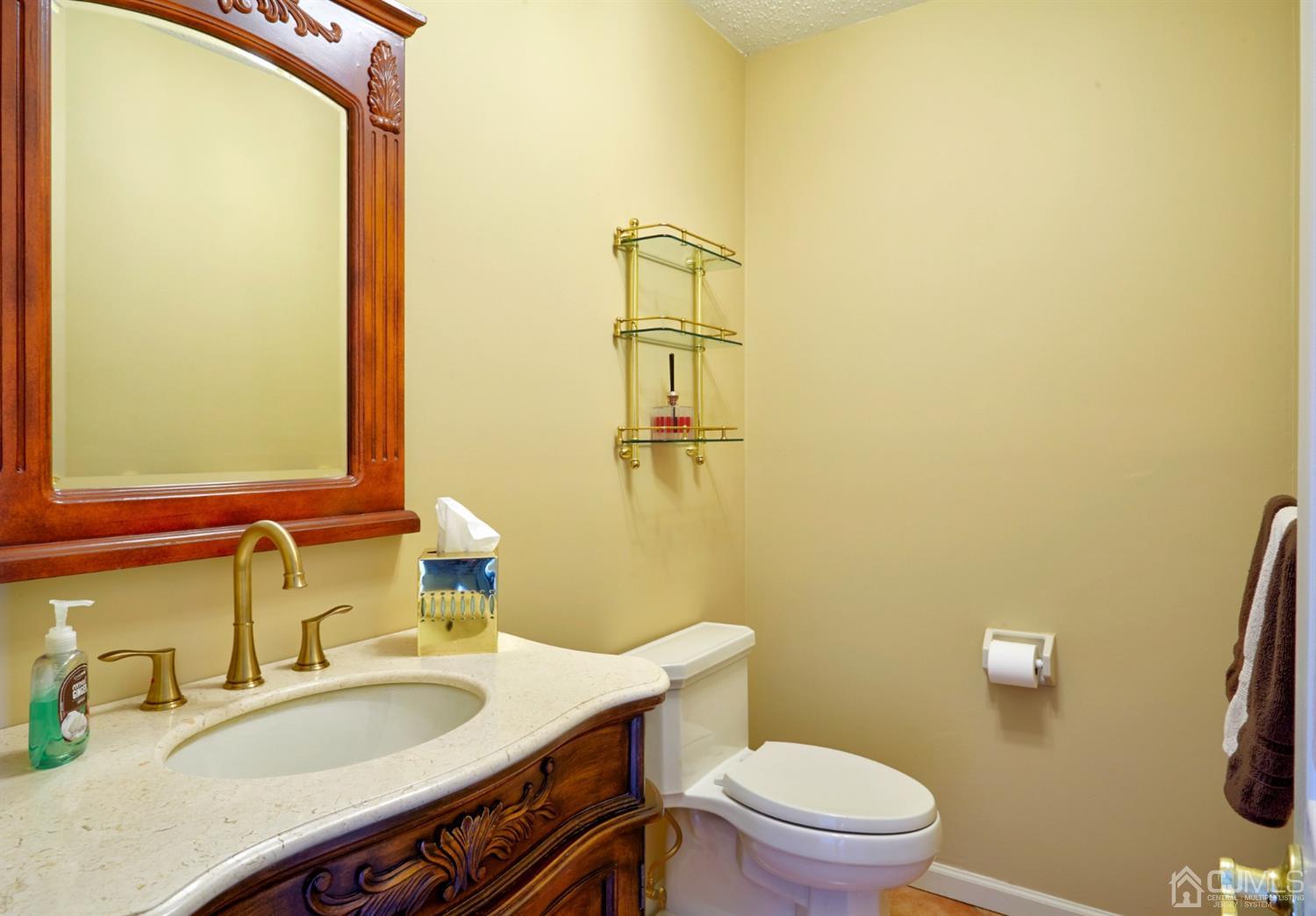 21 Aqueduct Place Howell, NJ 07731 - Photo 37 of 44 a bathroom with a granite countertop sink vanity mirror and toilet