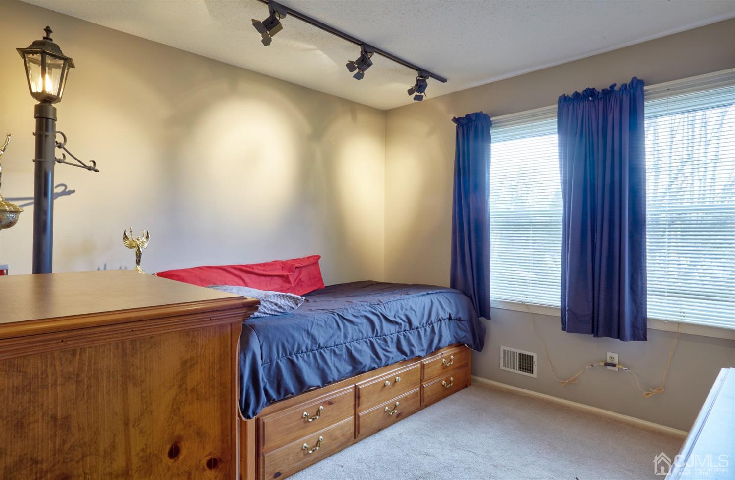 21 Aqueduct Place Howell, NJ 07731 - Photo 41 of 44 a bedroom with a bed and a window