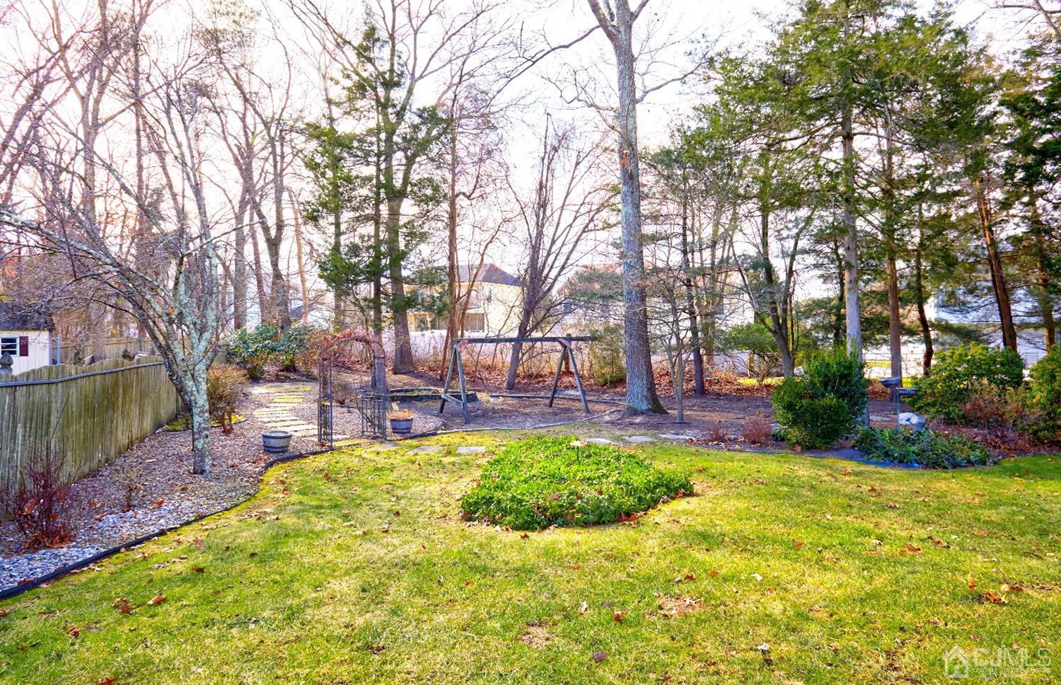 21 Aqueduct Place Howell, NJ 07731 - Photo 43 of 44 a view of a backyard with a garden