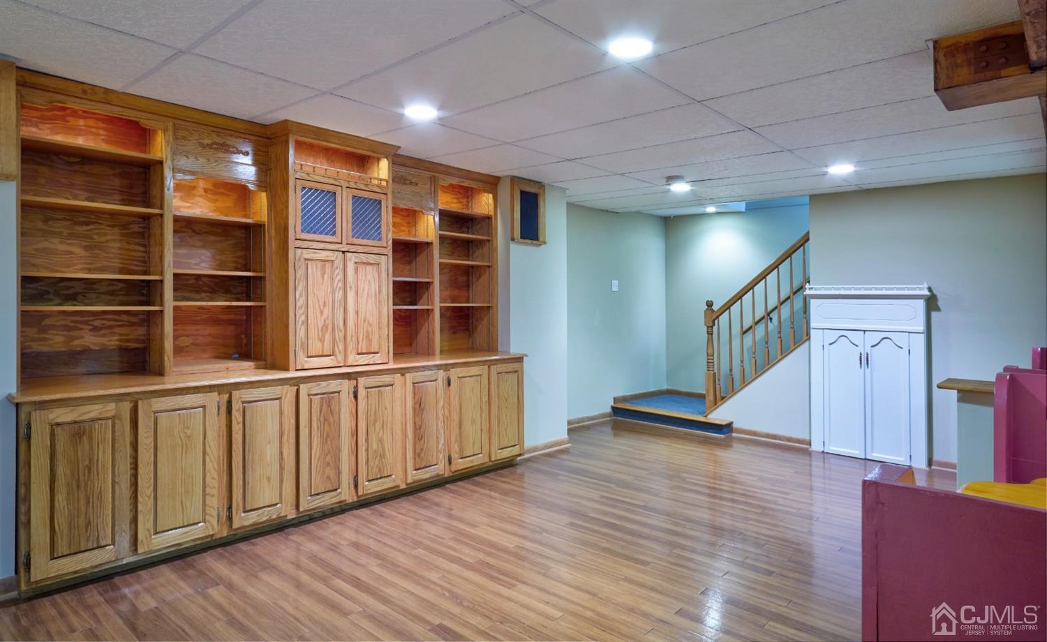 21 Aqueduct Place Howell, NJ 07731 - Photo 10 of 44 a view of an empty room with wooden floor and a window