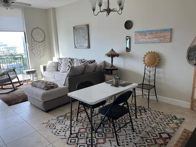 a living room with furniture and a large window