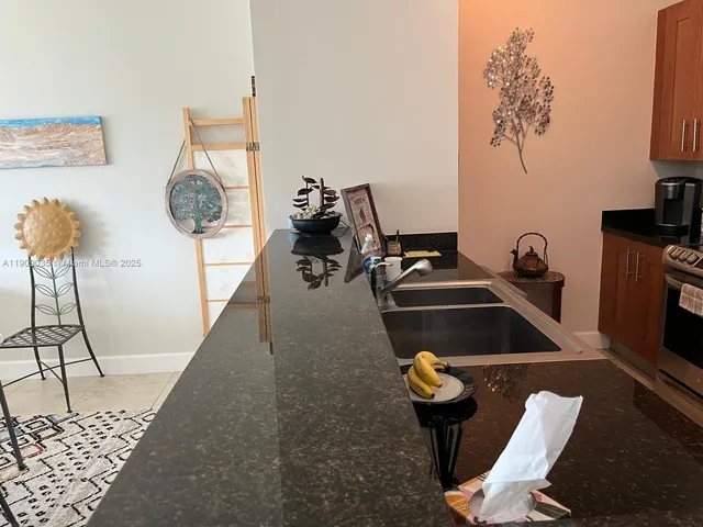 a living room with furniture and a mirror