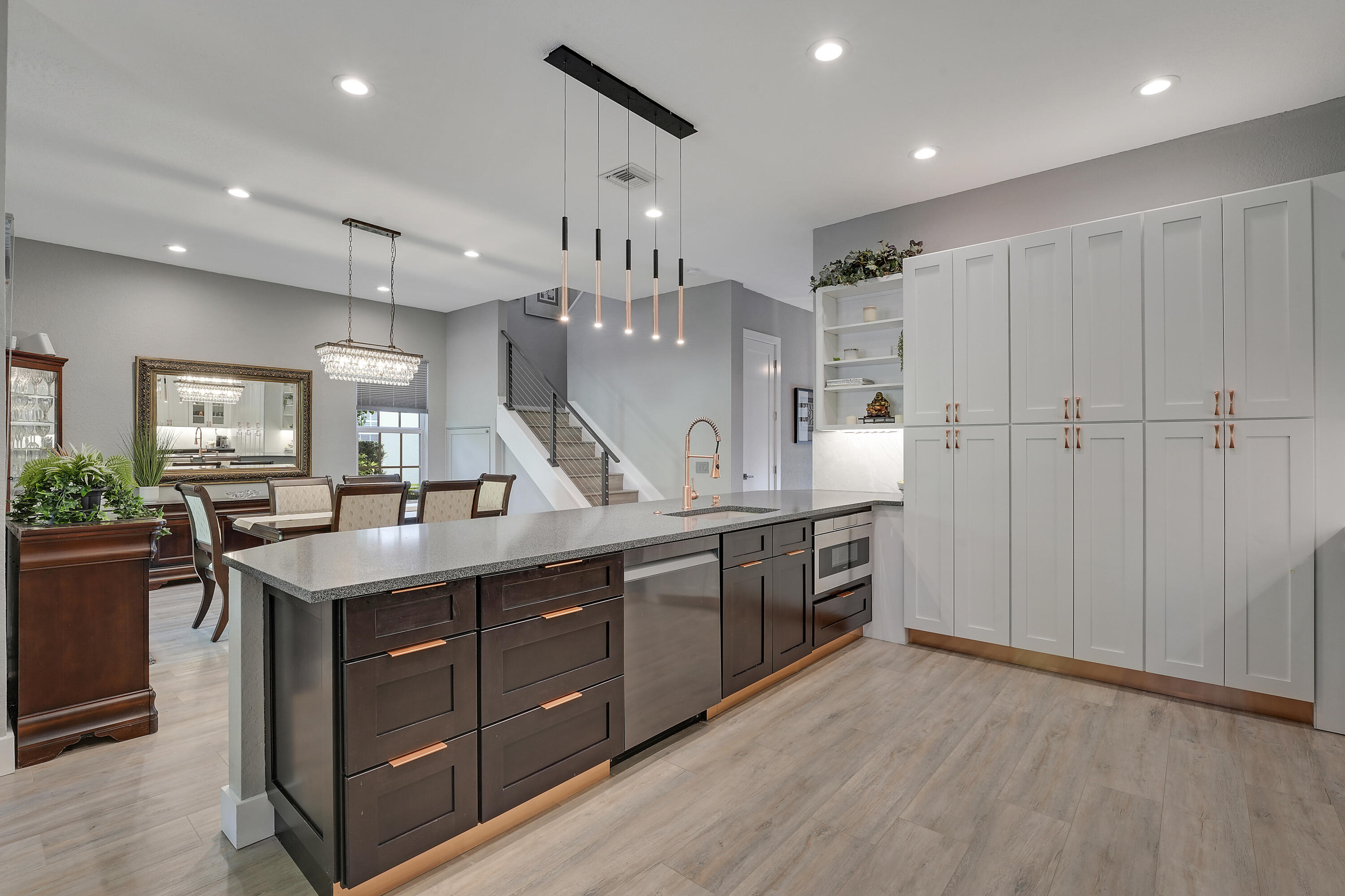 127 Via Castilla Jupiter, FL 33458 - Photo 19 of 80 a kitchen with stainless steel appliances granite countertop a sink and stove