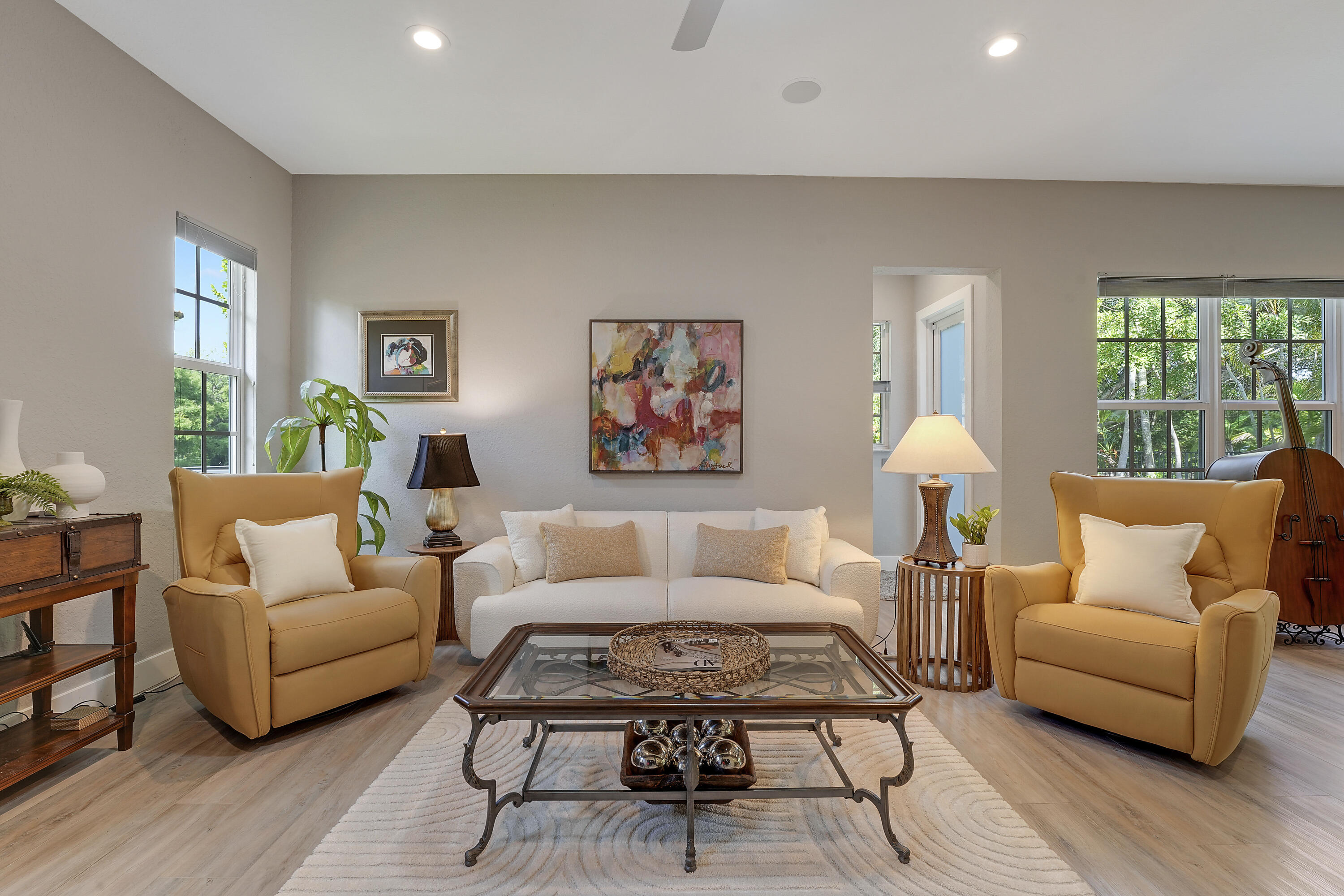 127 Via Castilla Jupiter, FL 33458 - Photo 25 of 80 a living room with furniture a large window and a wooden floor