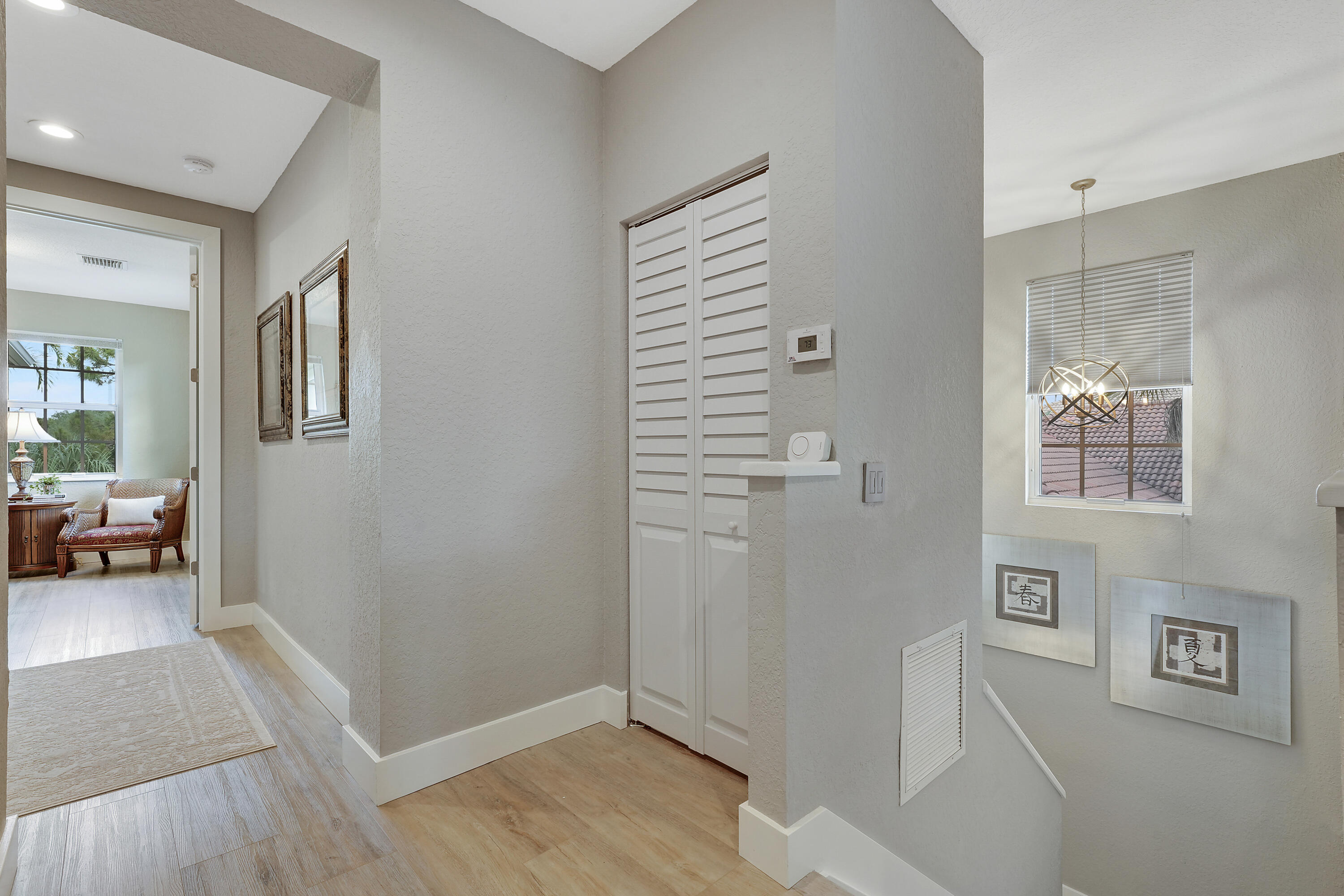 127 Via Castilla Jupiter, FL 33458 - Photo 31 of 80 a view of a livingroom with wooden floor and a couch