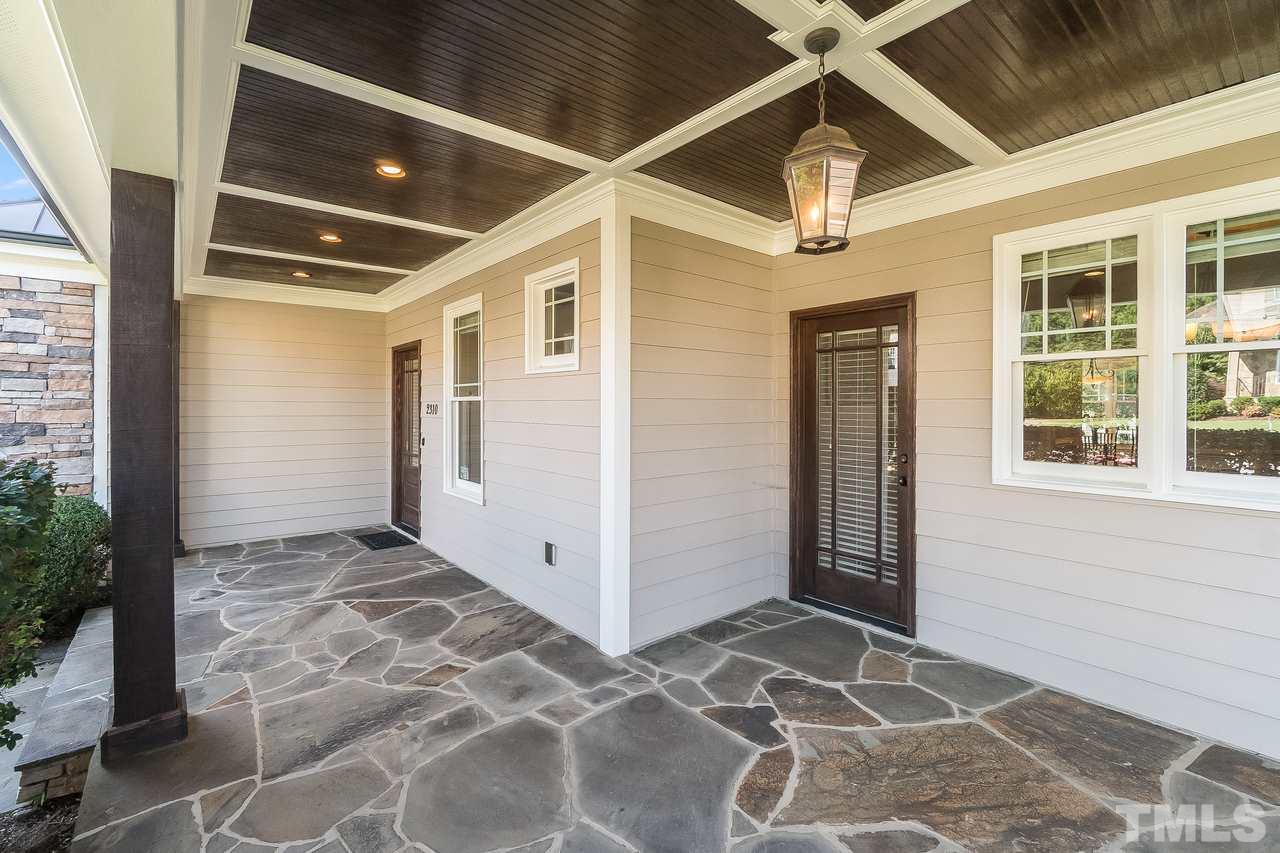 2310 Finley Ridge Lane Raleigh, NC 27615 - Photo 3 of 29 Rocking away on this stone laid porch.