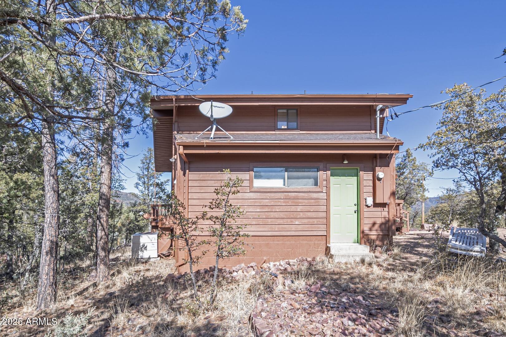 6181 Sharyn Road Pine, AZ 85544 - Photo 46 of 46 a front view of a house with garden