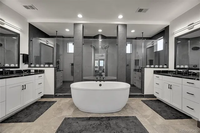 a large room with mirror and view of bathroom