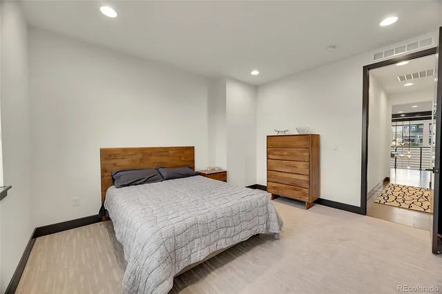 a bedroom with a bed and a cabinets