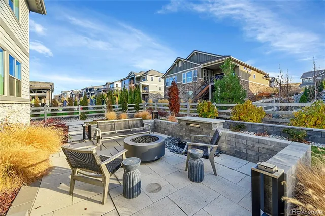 a view of a patio with swimming pool table and chairs