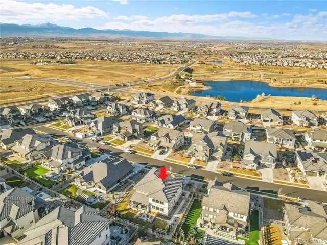an aerial view of residential building and ocean