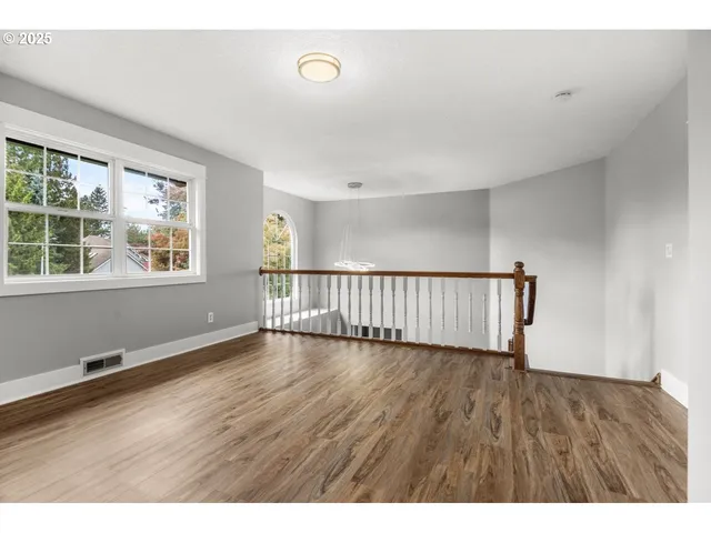 a bathroom with a granite countertop sink a toilet and a mirror