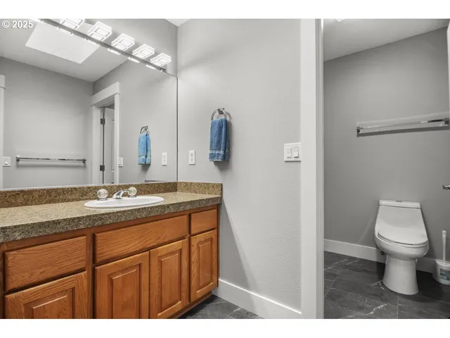 a bathroom with a shower and a sink