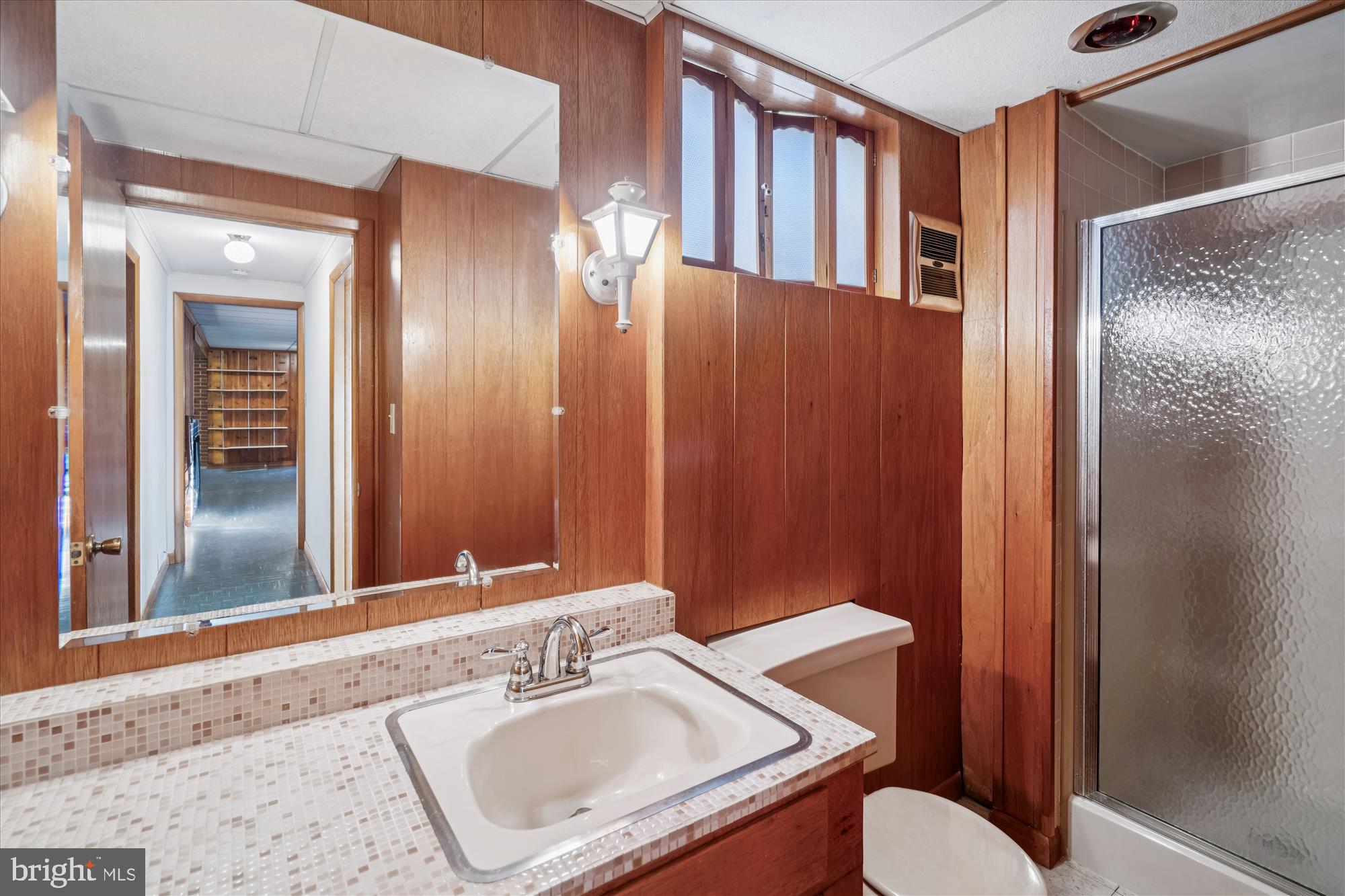 1912 Kimberly Road Silver Spring, MD 20903 - Photo 35 of 45 a bathroom with a sink a mirror and a toilet
