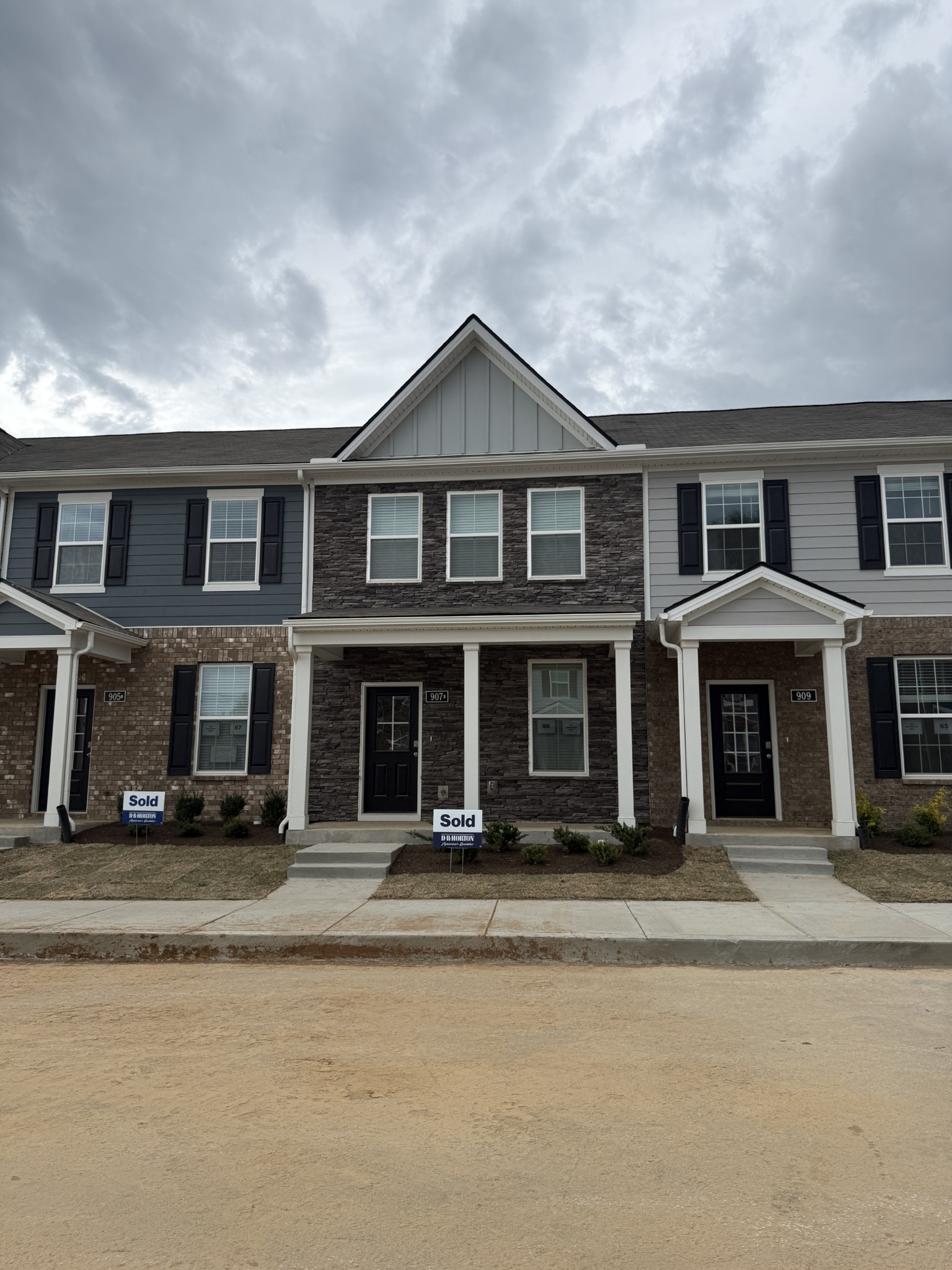 a front view of a house with a lots of windows