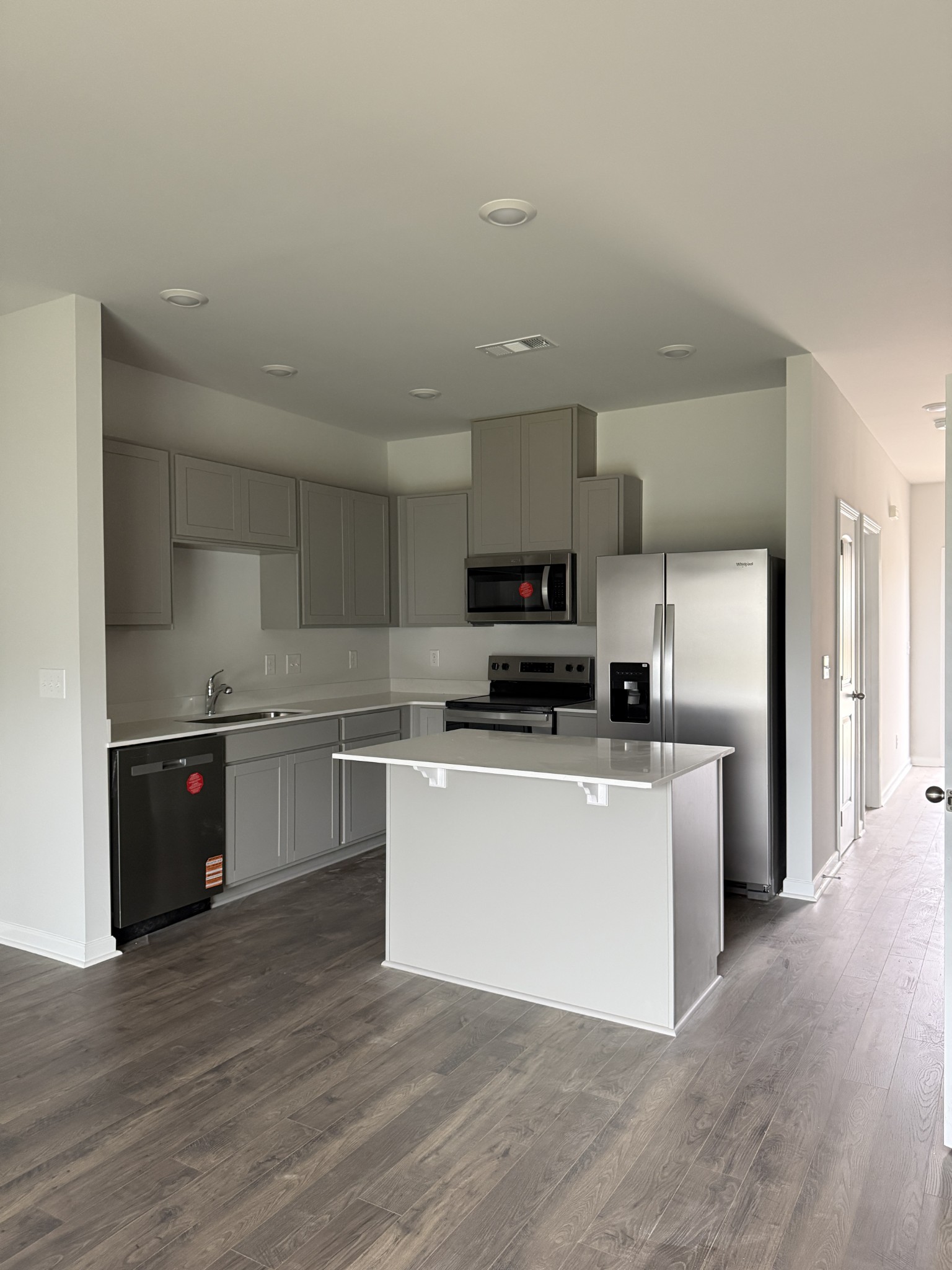 907 Highfield Way Lebanon, TN 37087 - Photo 3 of 10 a kitchen with stainless steel appliances a refrigerator and a stove top oven