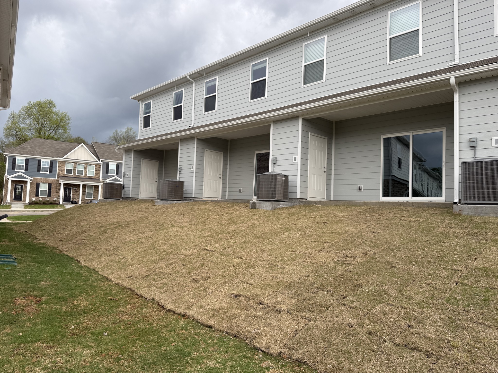 907 Highfield Way Lebanon, TN 37087 - Photo 8 of 10 a view of a white house with large windows