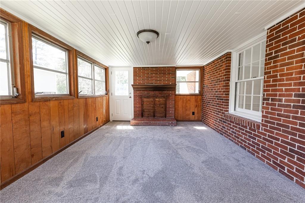 2115 Pinellas Trail Decatur, GA 30033 - Photo 11 of 29 a view of an empty room with a window and fireplace