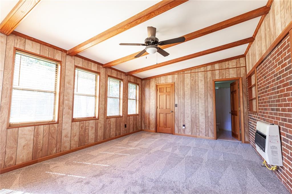 2115 Pinellas Trail Decatur, GA 30033 - Photo 14 of 29 an empty room with windows and chandelier fan