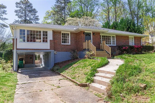 a front view of house with yard and green space