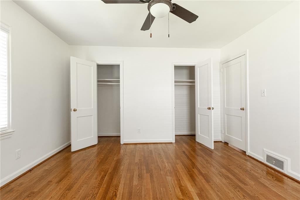 2115 Pinellas Trail Decatur, GA 30033 - Photo 24 of 29 an empty room with wooden floor closet and windows