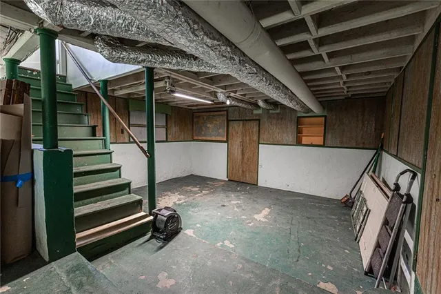 a view of an empty room with stairs