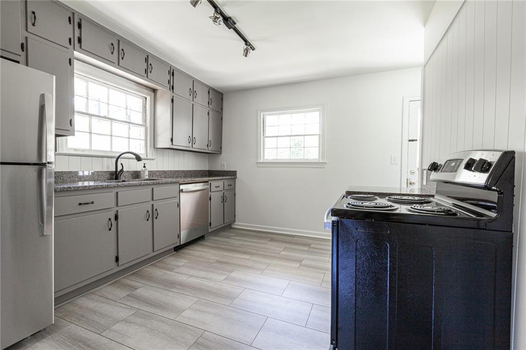 2115 Pinellas Trail Decatur, GA 30033 - Photo 4 of 29 a kitchen with a sink stove and cabinets