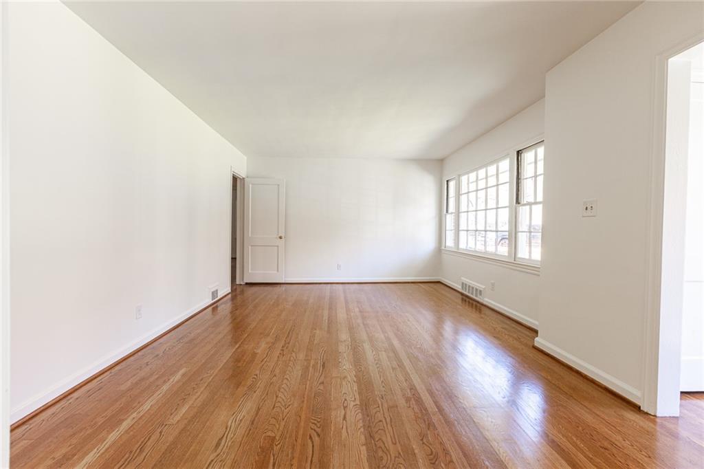 2115 Pinellas Trail Decatur, GA 30033 - Photo 6 of 29 an empty room with wooden floor and windows