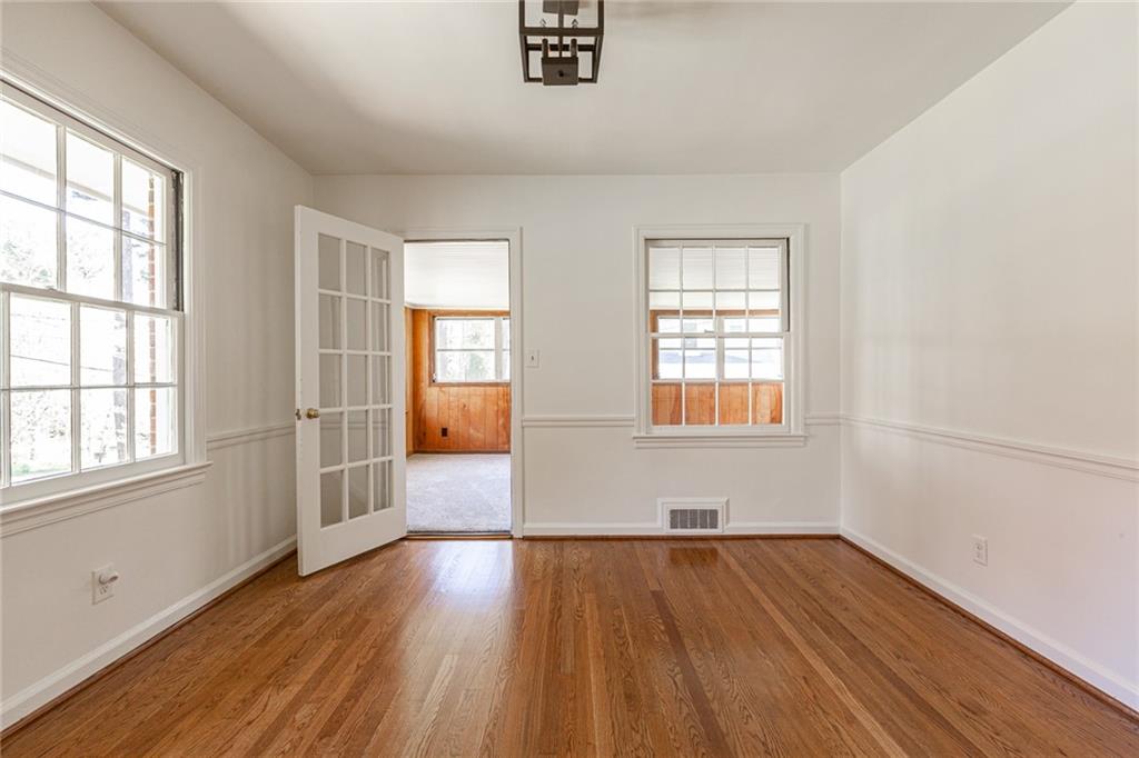 2115 Pinellas Trail Decatur, GA 30033 - Photo 9 of 29 an empty room with wooden floor and windows