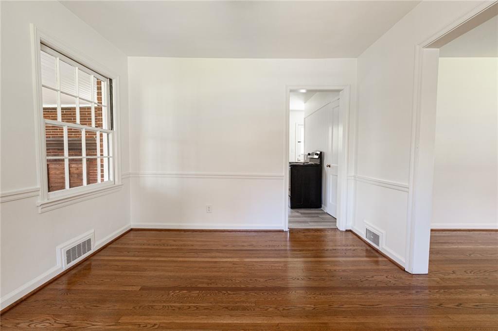 2115 Pinellas Trail Decatur, GA 30033 - Photo 10 of 29 a view of a black and white wall with wooden floor