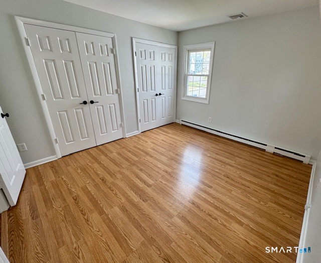 15 Juniper Road Bethel, CT 06801 - Photo 11 of 17 a view of an empty room with wooden floor and a window