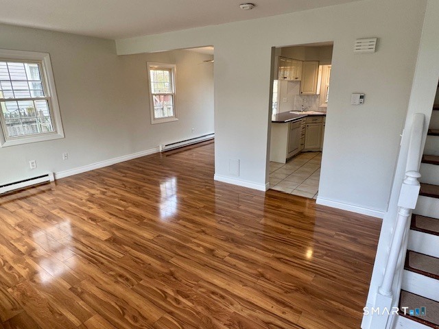 15 Juniper Road Bethel, CT 06801 - Photo 4 of 17 wooden floor in an empty room with a window