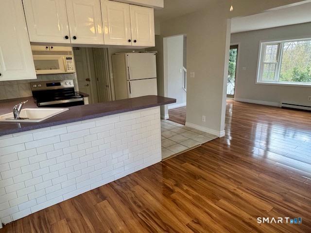 15 Juniper Road Bethel, CT 06801 - Photo 6 of 17 a kitchen with granite countertop wooden cabinets a sink and dishwasher