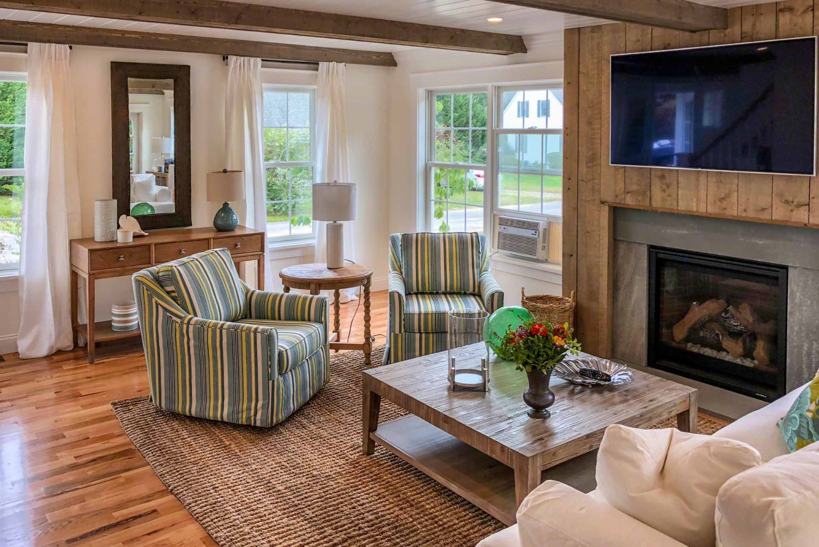 2 Southridge Lane Edgartown, MA 02539 - Photo 4 of 6 a living room with furniture and a fireplace
