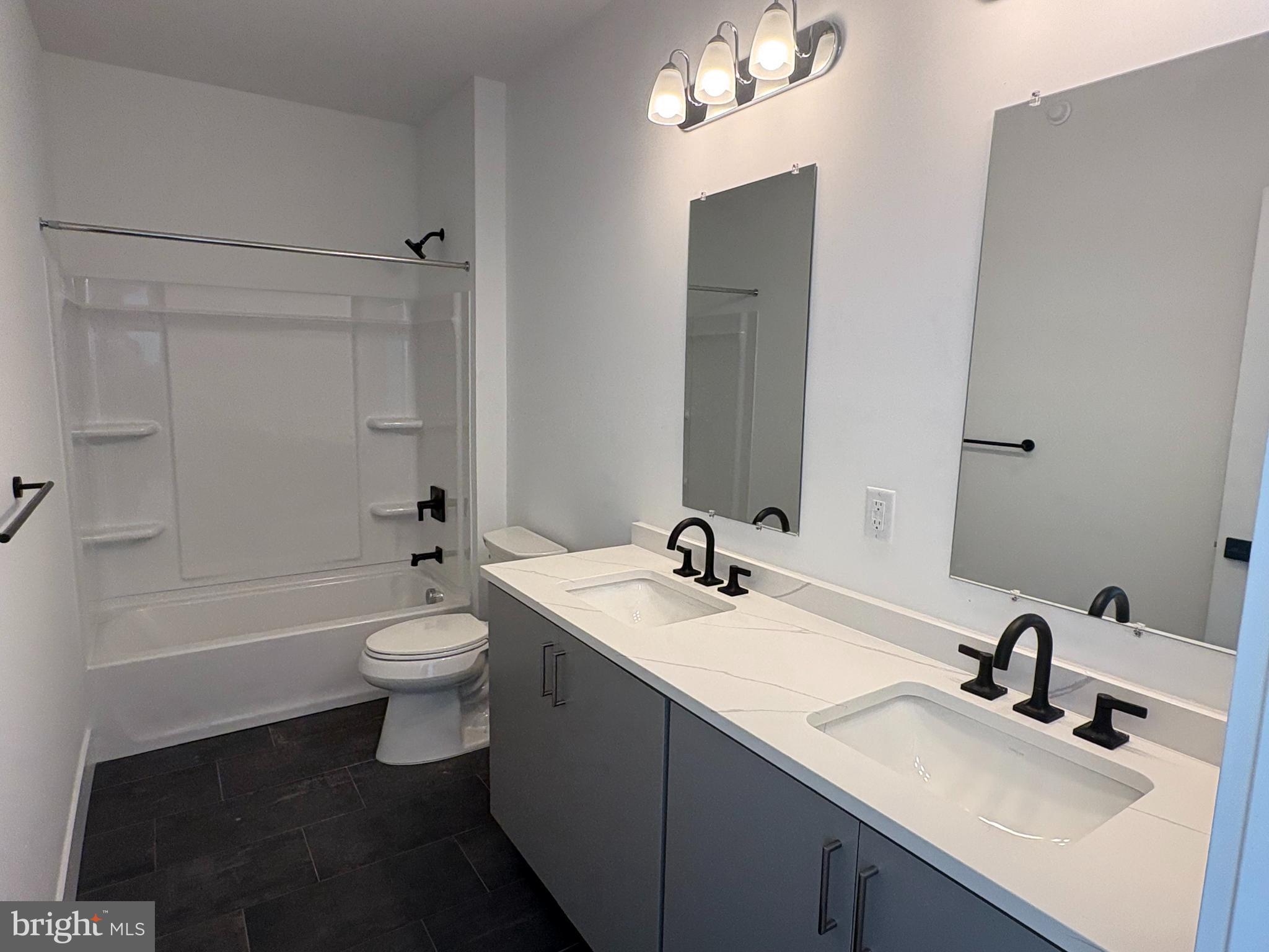 8207 Donatello Drive, Unit 872 Princeton, NJ 08540 - Photo 15 of 27 a bathroom with a sink and a mirror
