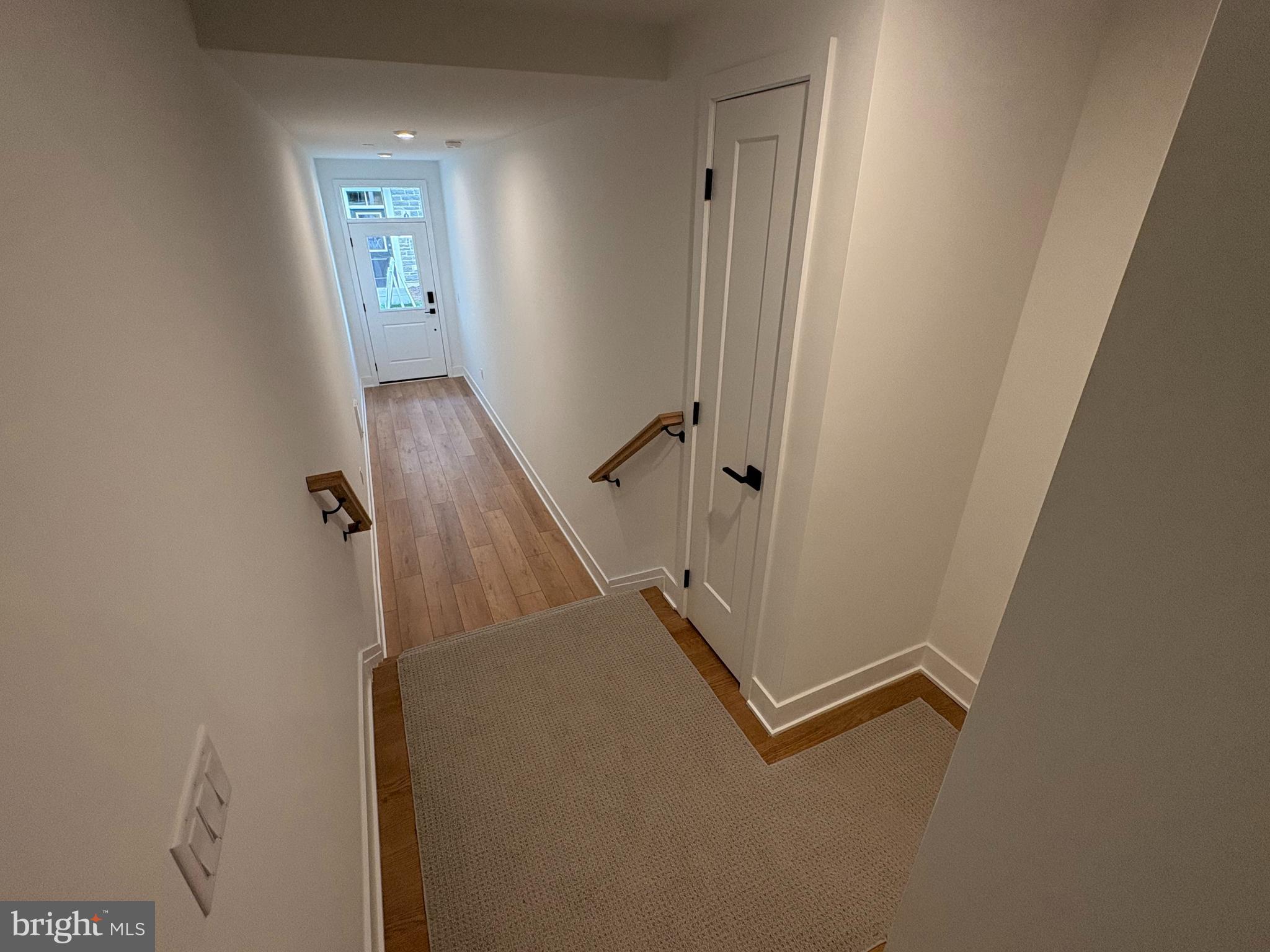 8207 Donatello Drive, Unit 872 Princeton, NJ 08540 - Photo 24 of 27 a view of a hallway with stairs