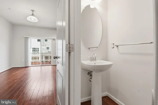 a bathroom with a sink a mirror and a toilet