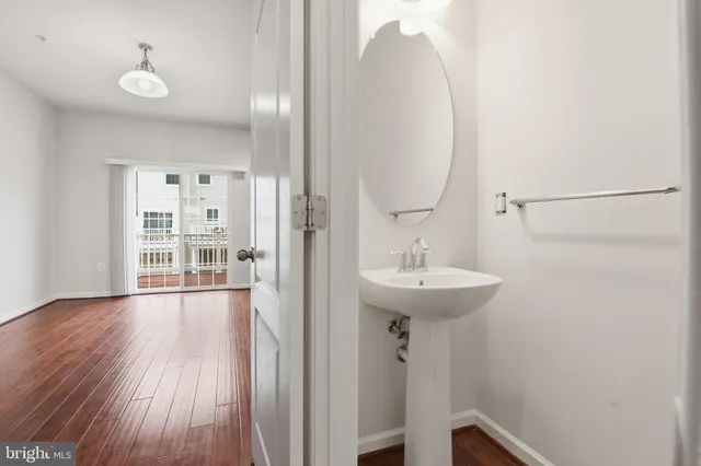 a bathroom with a sink a mirror and a toilet