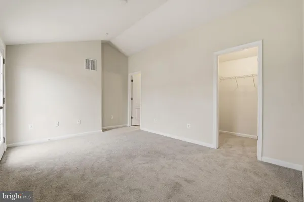 an empty room with closet area