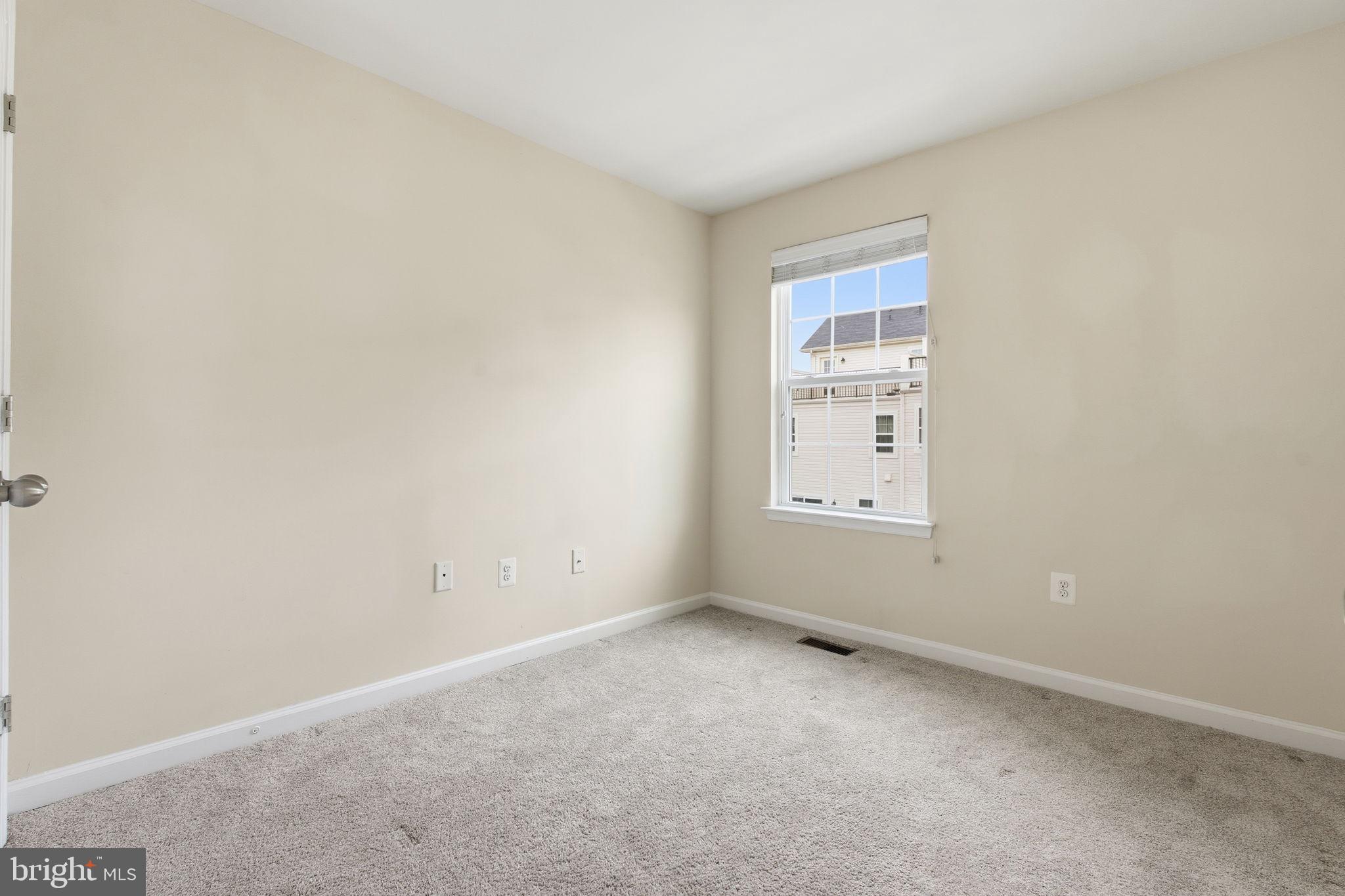 7025 Southmoor Street Hanover, MD 21076 - Photo 25 of 35 a view of an empty room with a window