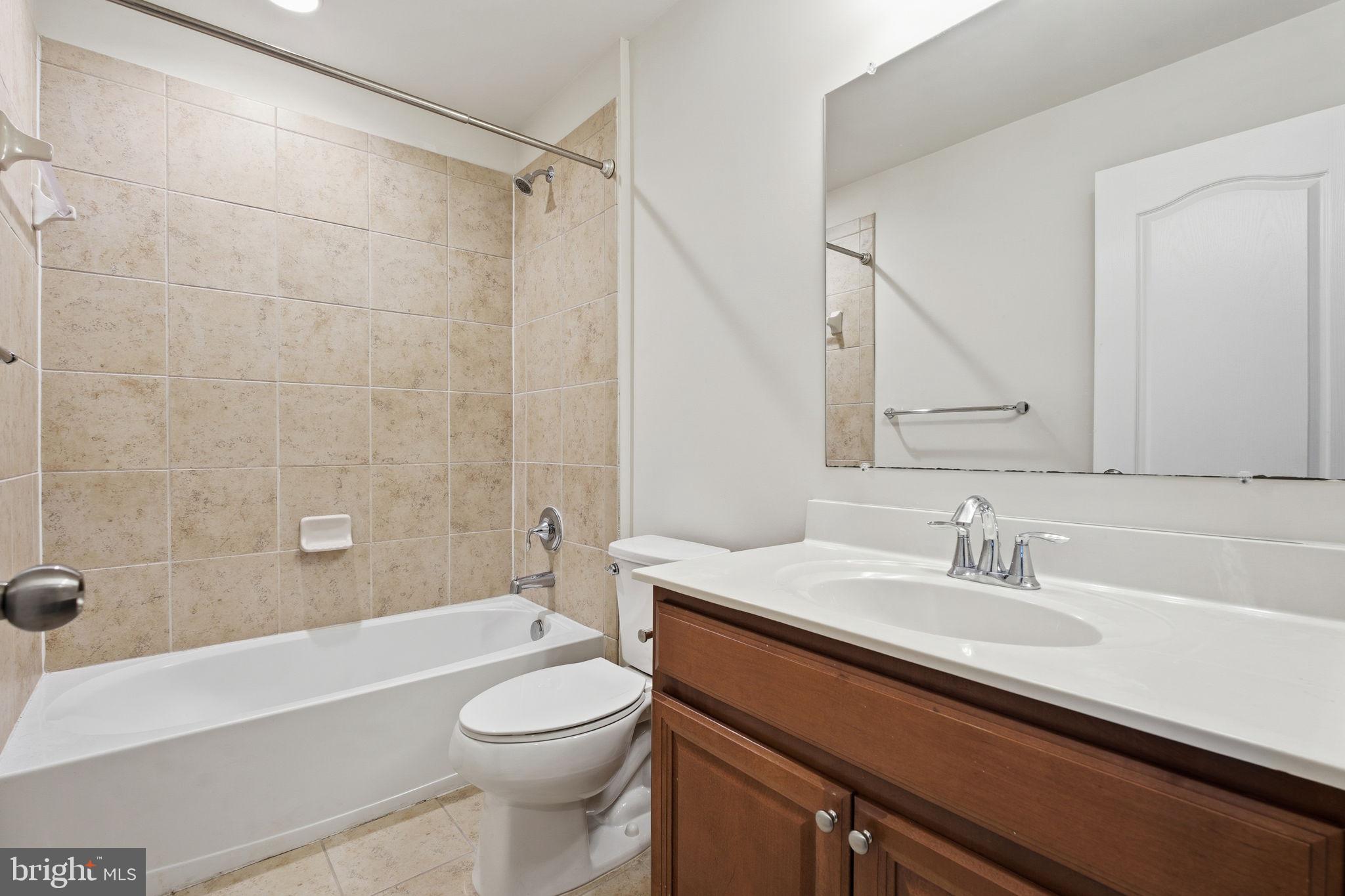 7025 Southmoor Street Hanover, MD 21076 - Photo 28 of 35 a bathroom with a sink a toilet and a bathtub