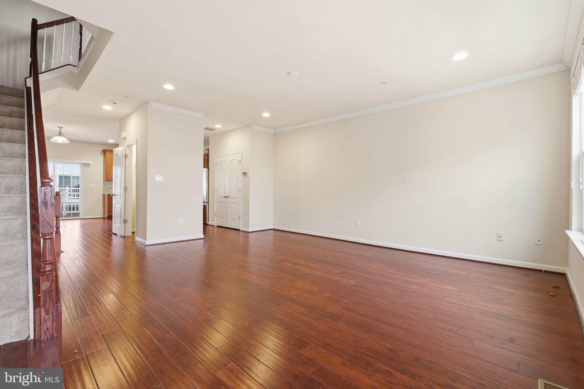 7025 Southmoor Street Hanover, MD 21076 - Photo 10 of 35 a view of an empty room with wooden floor