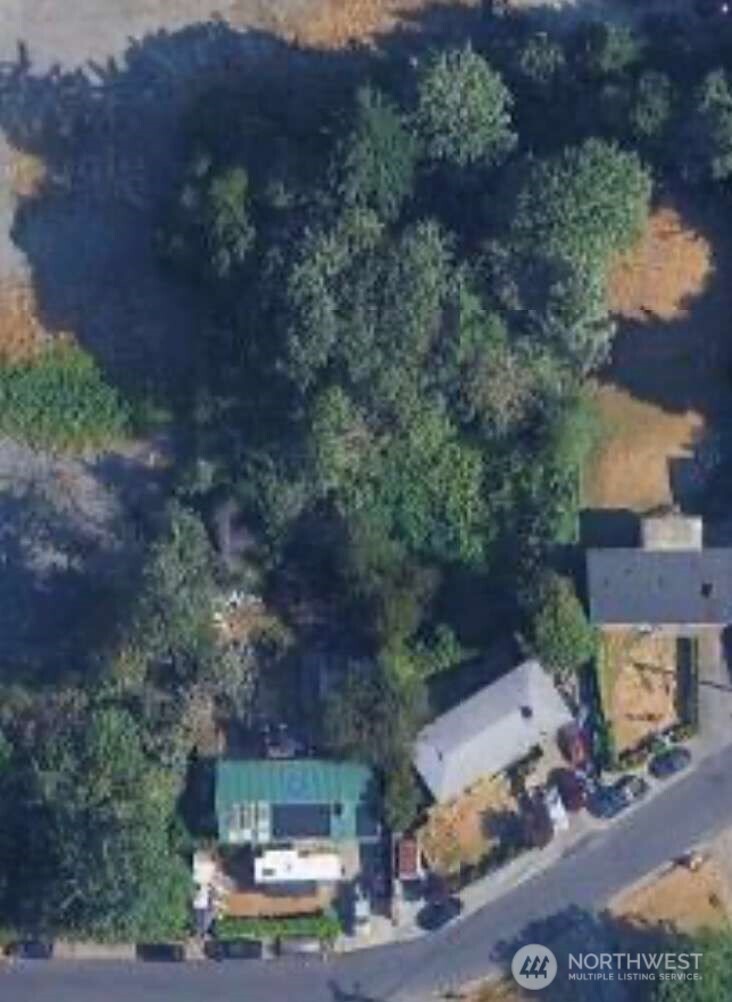 an aerial view of a house with outdoor space