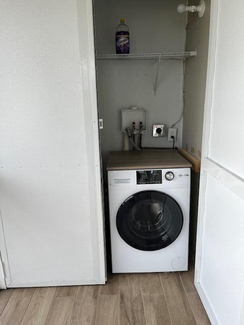 740 Monaco P, Unit P Delray Beach, FL 33446 - Photo 11 of 14 a utility room with wooden floor washer and dryer