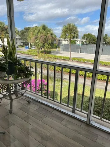 a view of swimming pool with a table and chairs